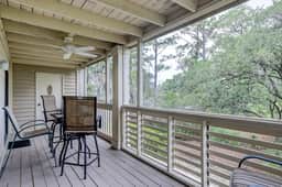 Fully updated condo with serene view, enclosed balcony, WiFi, W/D, pool, & gym