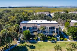 Lovely condo near beach with enclosed porch, pool, tennis, and golf access