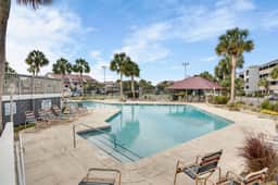 Second-floor villa w/ river views & community pool, tennis courts, and dock