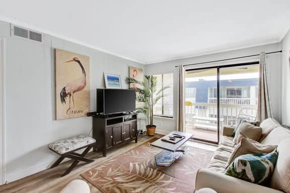 Comfortable villa one row away from the beach w/shared pool & grills