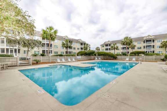 Lovely top floor villa in Wild Dunes with partial ocean views, pool, & W/D