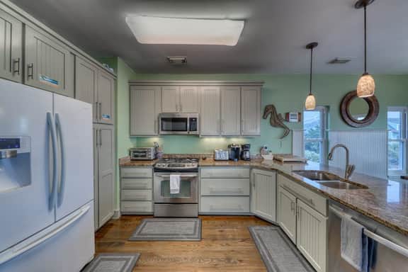 Raised oceanfront home with elevator & outdoor shower just steps from beach