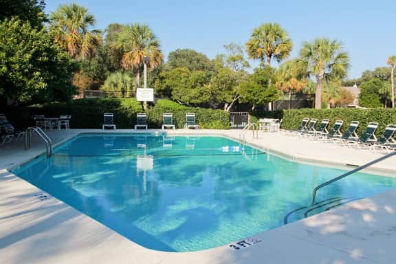 Renovated townhome next to golf course w/ community pool access- close to beach