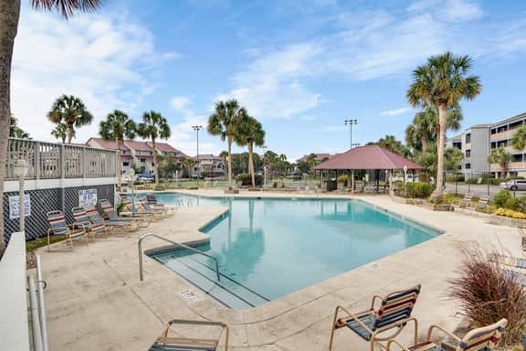 Second-floor villa w/ river views & community pool, tennis courts, and dock