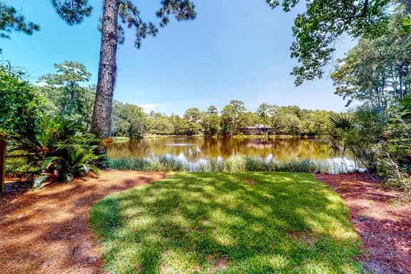 Updated island estate with serene lagoon views & 2 decks - bike to beach